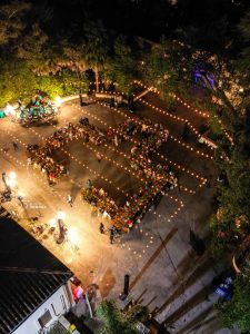 temporary bistro lighting setup at event with structure